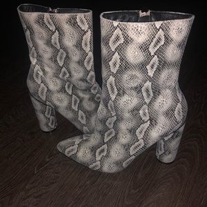 Snake skin heeled boots